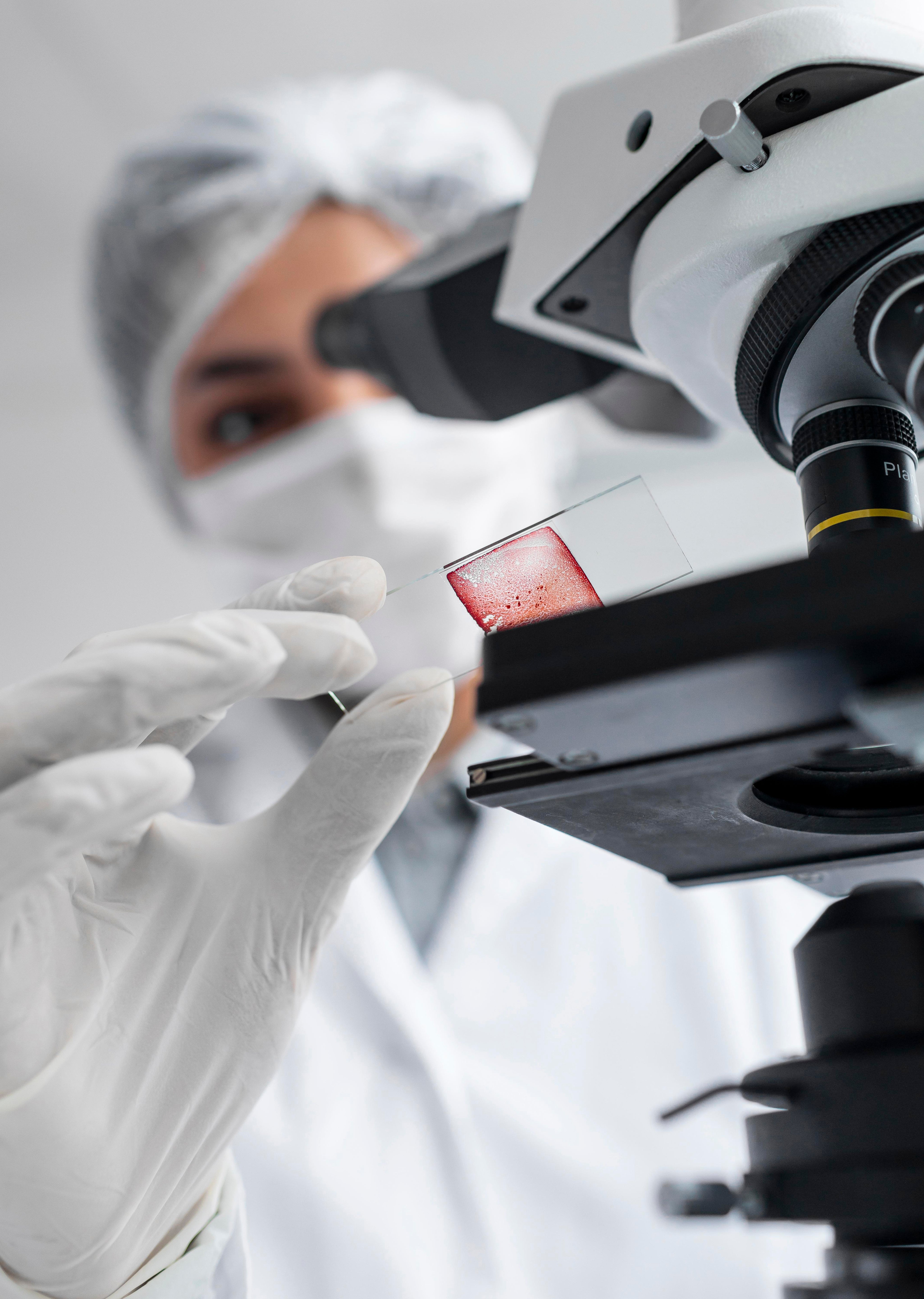 close-up-blurry-scientist-working-with-glass-slide.jpg